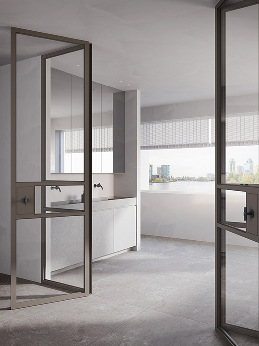 Piet Boon COAST Tile vloer in een lichte badkamer achter stalen glasdeuren